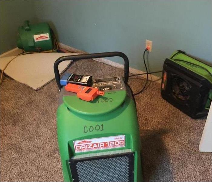 Water Damage - image of green equipment placed in home
